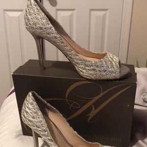 Enzo Angiolini Silver peep toe heels.